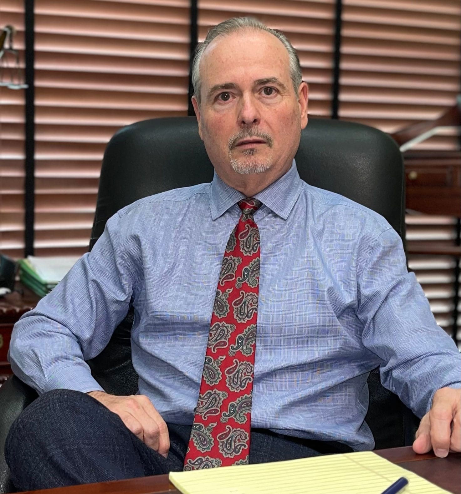 Brian E. Gonzalez Sitting At His Desk In His Office